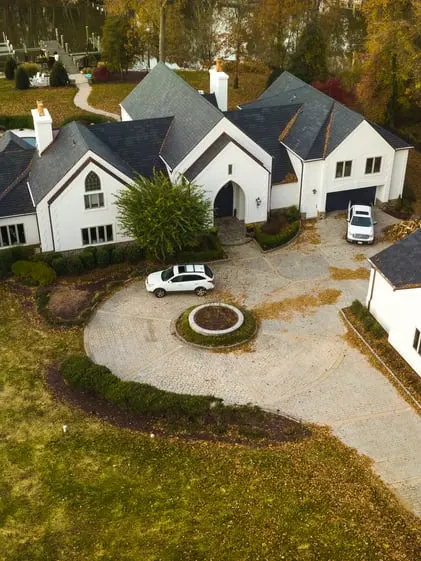 Home with Brava synthetic roofing and circular driveway