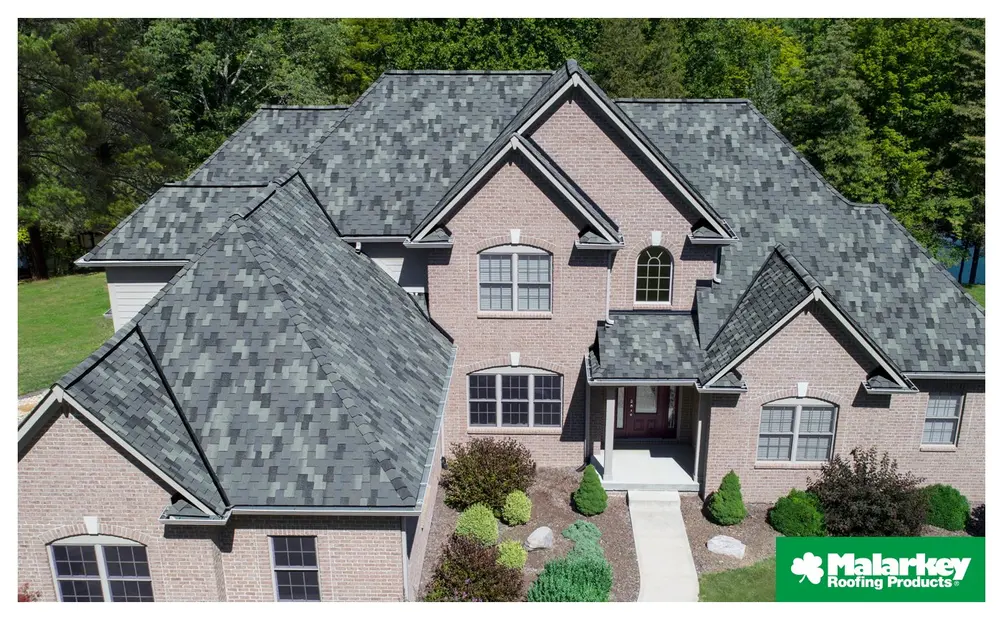 Brick home with green-gray Malarkey shingles