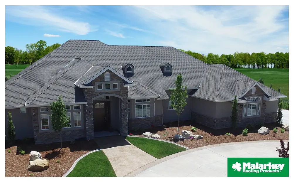 Large home with gray Malarkey roofing shingles