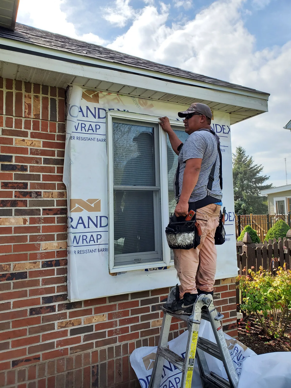 Window installation in progress in Aurora IL by RG Roofing & Exteriors