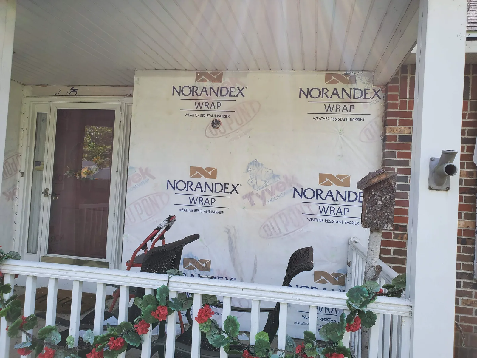 Exterior wall preparation for window installation in Aurora IL by RG Roofing & Exteriors