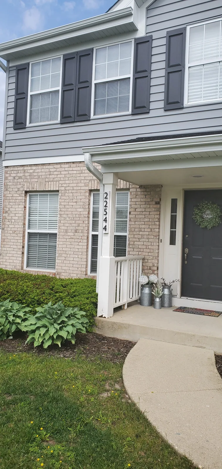Completed siding repair and exterior finish in Naperville IL by RG Roofing & Exteriors