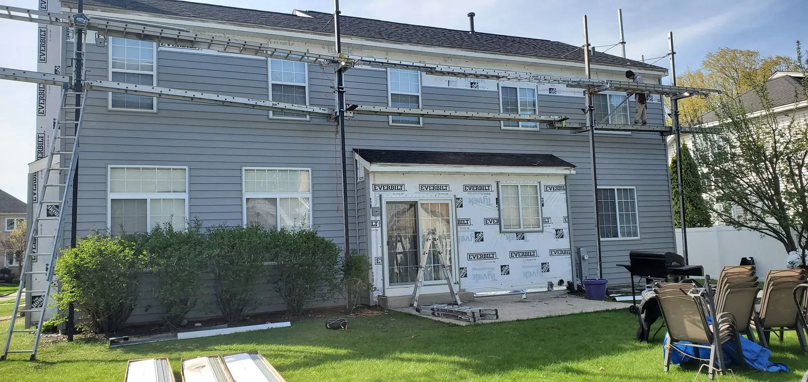 Siding repair project in progress in Naperville IL by RG Roofing & Exteriors