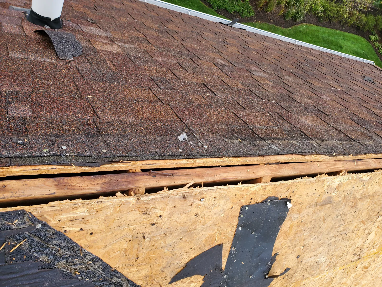 Storm damaged roof before replacement in Aurora IL by RG Roofing & Exteriors